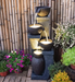 4 Pots Spilling Pillars Water Feature Fountain at backyard view
