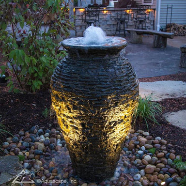 Aquascape Stacked Slate Urn Fountain Kit in the garden