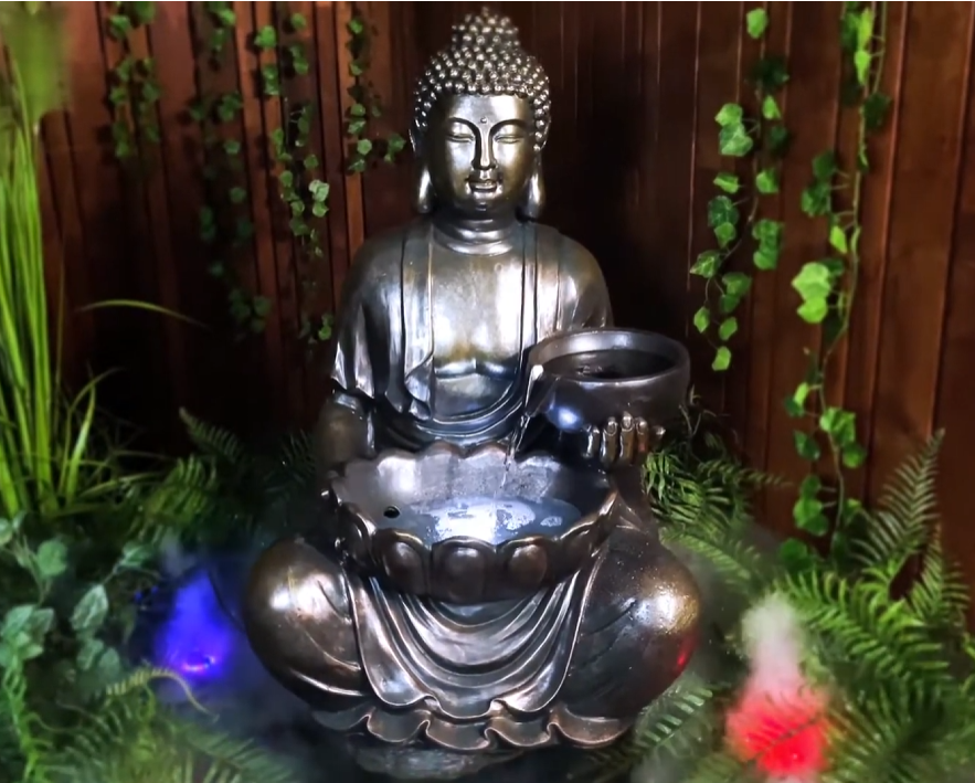 Tranquil sitting Buddha with bowl water feature fountain Water flow