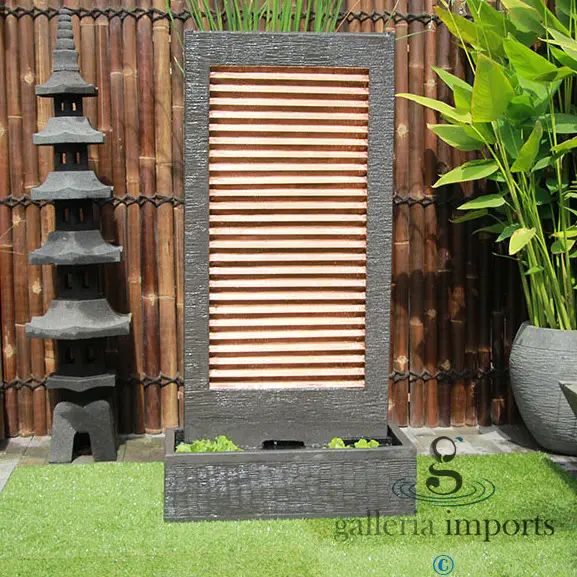 Zig Zag Copper Wall Water Feature in the garden