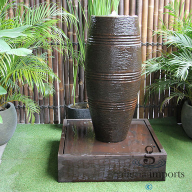 cuban urn fountain rust colour with plants