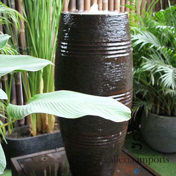 cuban urn water feature fountain with green plants