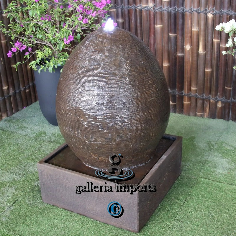 egg balinese style fountain outdoor rust right angle view