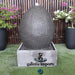 egg shaped outdoor water fountain grey front view