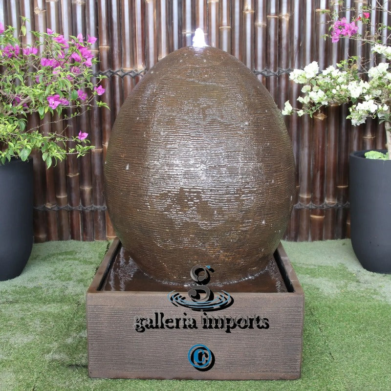 large egg Balinese Style water feature rust front view