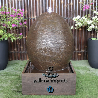 large egg water feature rust front view