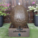 large egg water feature rust front view