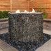 stacked slate wall fountain and wood fence background